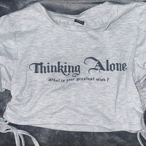 Grey crop top with ties on sides to tighten